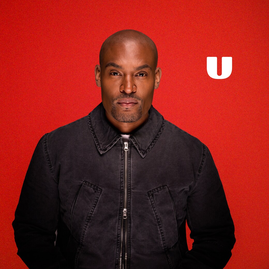 Paul C. Brunson in the Red Flag promotional portrait, against a red background with the U logo